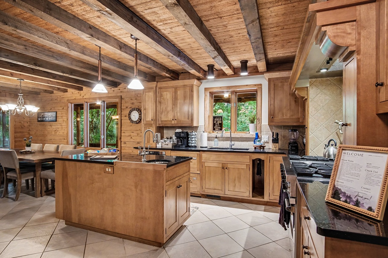 Kitchen and breakfast nook inside a Pine Ridge Retreats log cabin