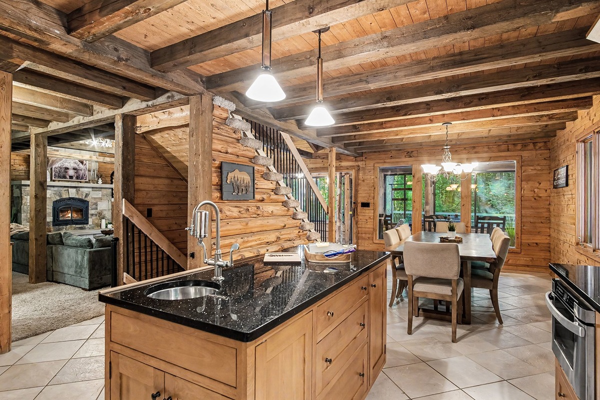 Kitchen island looking toward the dining area and stone fireplace