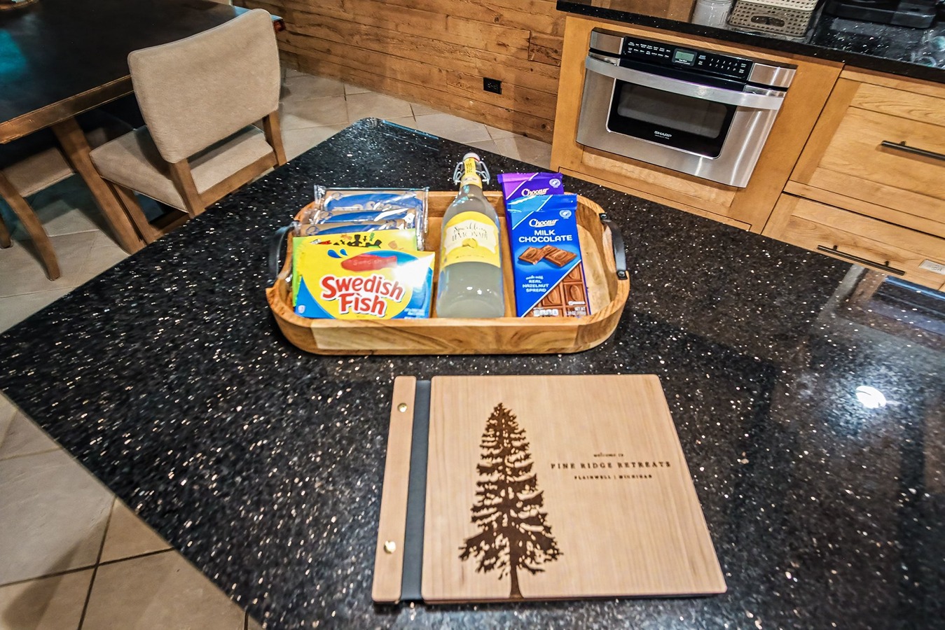 Guest welcome basket on the kitchen counter at Pine Ridge Retreats