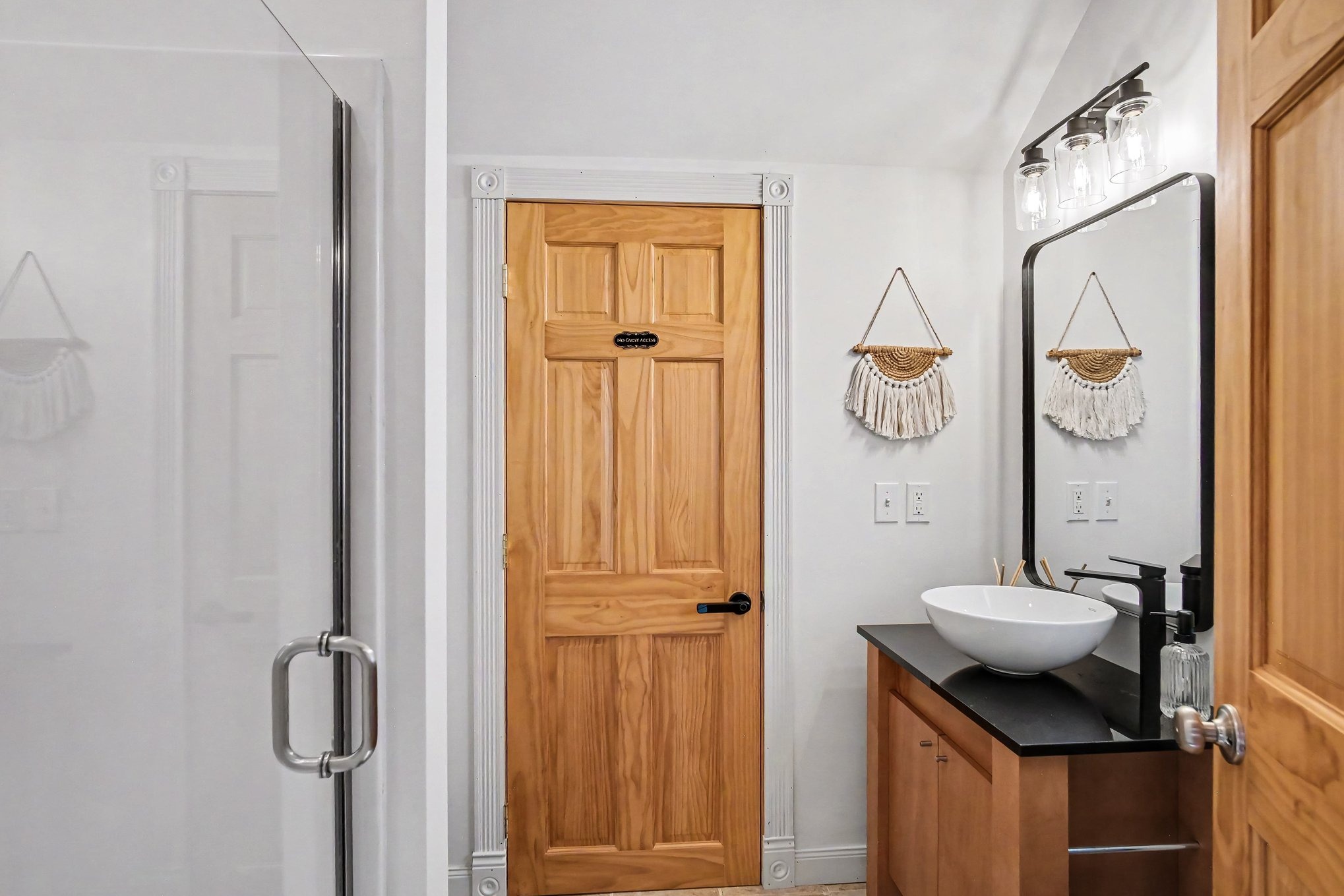 Bathroom with walk-in shower and vessel sink